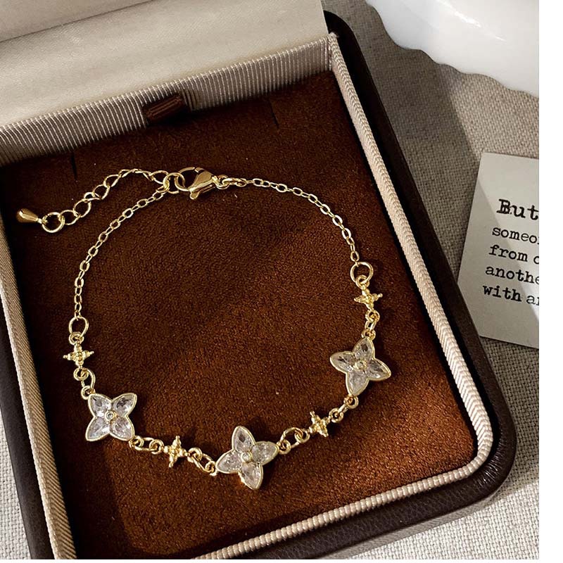 Second image of Pastel Flower & Star Gold Bracelet