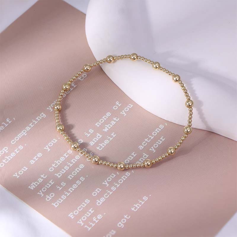 Second image of  gold diamond-encrusted snake-style bangle