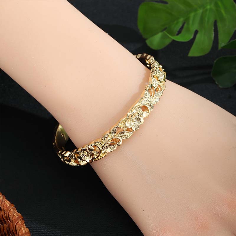 carved hollow gold bangle